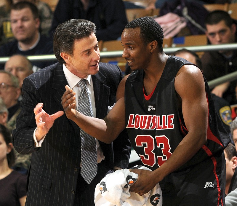 his Feb. 12, 2009, file photo shows Louisville coach Rick Pitino, left, talking with guard Andre McGee during the first half of an NCAA college men's basketball game against Notre Dame in South Bend, Ind. Louisville said Friday, Oct. 2, 2015, it has launched an investigation into allegations that former Cardinals staffer McGee paid an escort service to provide sex for recruits.