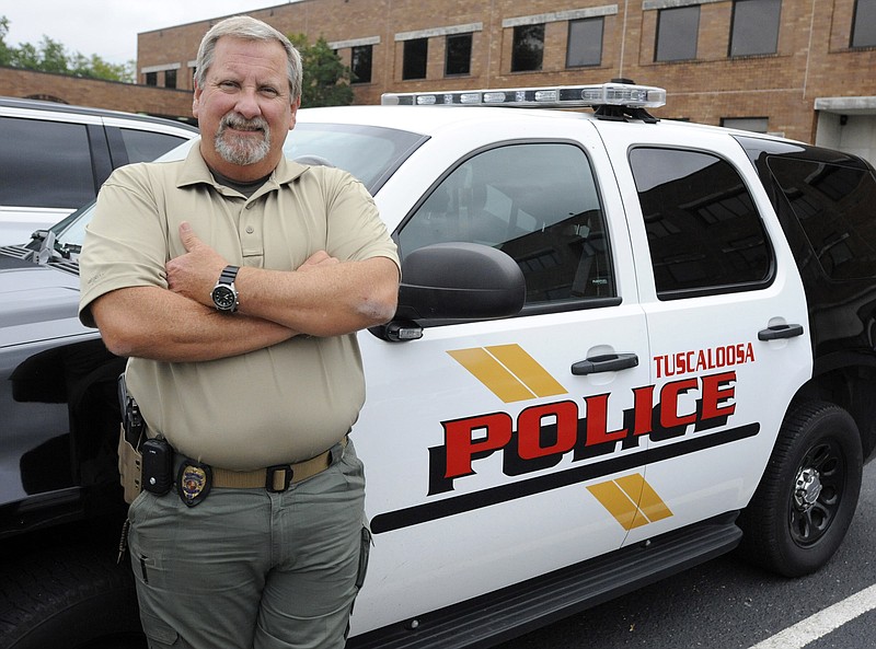 This photo taken Wednesday, Sept. 30, 2015, in Tuscaloosa, Ala., shows police Capt. Mike Flowers, who is retiring after 35 years without a sick day. Flowers, who also didn't miss school after a bout with measles in the first grade, said his parents taught him to get up and get going each day. (AP Photo/Jay Reeves)