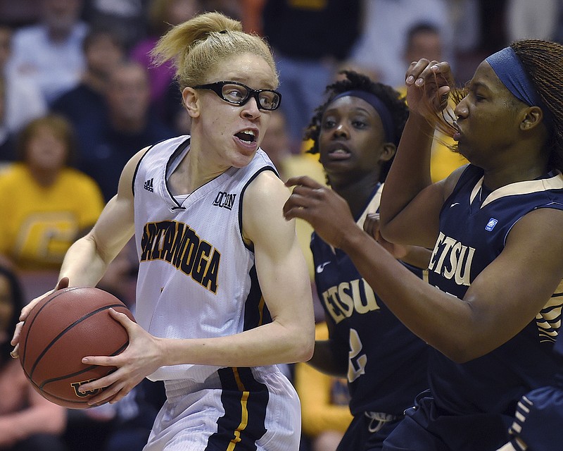 UTC guard Alicia "Red" Payne, shown looking to pass against East Tennessee State during the Southern Conference tournament last March, is the lone senior for the Mocs as they begin practice for the 2015-16 season today.