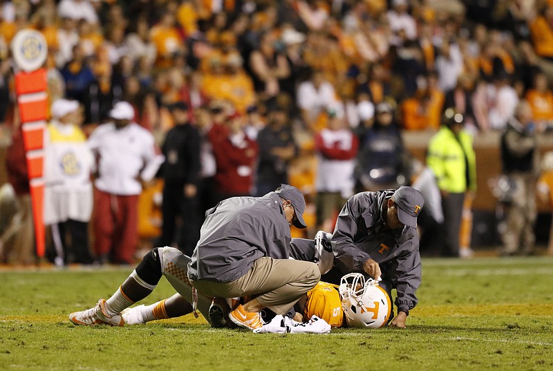 Staff Photo by Dan Henry / The Chattanooga Times Free Press- 10/3/15. UT's Kyle Phillips (5) is injured while playing Arkansas during the second quarter of play on October 3, 2015. The Volunteers played the Razorbacks at home in Neyland Stadium late Saturday evening. 