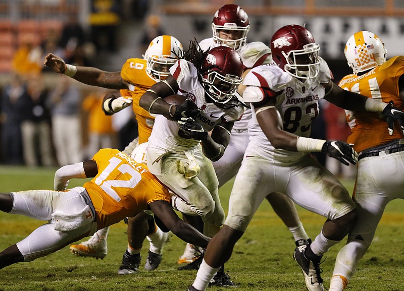 Arkansas's Alex Collins (3) dodges tackle by UT defenders during the fourth quarter of play on October 3, 2015. The Volunteers lost to the Razorbacks 20-24 at home in Neyland Stadium late Saturday evening.