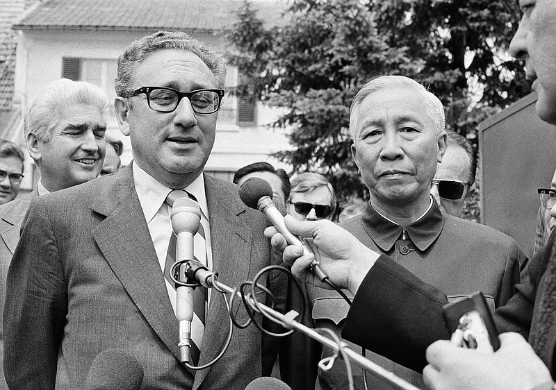 
              FILE - In this Wednesday June 13, 1973 file photo, President Nixon's National Security Adviser Henry A. Kissinger, left, and Le Duc Tho, member of Hanoi's Politburo, are shown outside a suburban house at Gif Sur Yvette in Paris after negotiation session. Founder of the Nobel Prize Alfred Nobel gave only vague instructions on how to select winners, leaving wide room for interpretation by the prize committees in Stockholm and Oslo. In 1973 U.S. Secretary of State Henry Kissinger and North Vietnamese leader Le Duc Tho were honored for their efforts to achieve a cease-fire in the Vietnam War in what’s become one of the most contentious awards in Nobel history. The Vietnamese leader refused to accept the award, Kissinger asked the U.S. ambassador to Norway to accept it for him, and the war dragged on for three more years. The prize was heavily criticized, particularly by those who opposed the Vietnam War and associated Kissinger with it. (AP Photo/Michel Lipchitz, file)
            