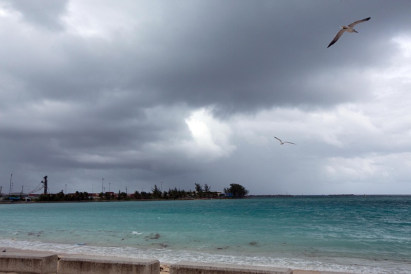 
              Skies begin to darken as Hurricane Joaquin passes through the region, seen from Nassau, Bahamas, early Friday, Oct. 2, 2015. Hurricane Joaquin dumped torrential rains across the eastern and central Bahamas on Friday as a Category 4 storm. (AP Photo/Tim Aylen)
            