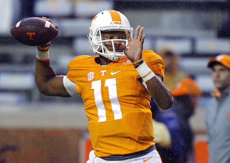 Tennessee quarterback Joshua Dobbs (11) throws to a receiver before the start of an NCAA college football game against Arkansas Saturday, Oct. 3, 2015, in Knoxville, Tenn.