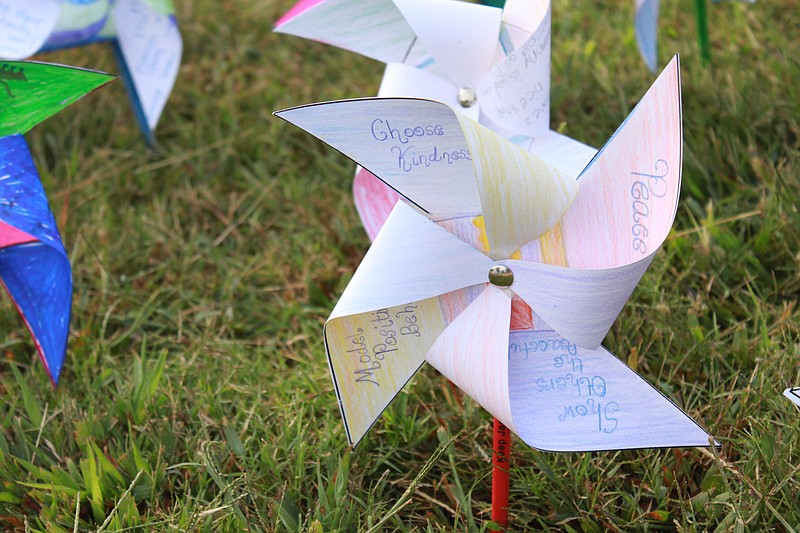 
              ADVANCE FOR THE WEEKEND OF OCT. 3-4 AND THEREAFTER - In a Sept. 14, 2015 photo, Students set up pinwheels celebrating the International Day of Peace Sept. 14 at the Montessori School of Bemis in Jackson, Tenn.  (Katherine Burgess/The Jackson Sun via AP) NO SALES; MANDATORY CREDIT
            