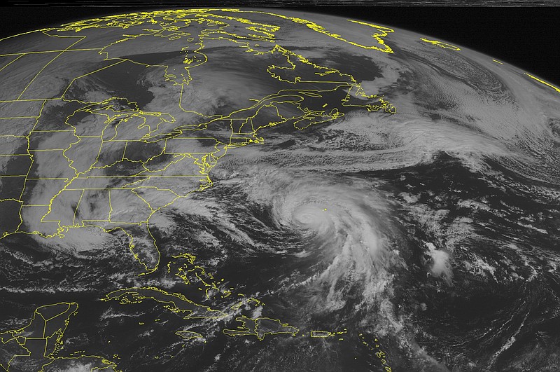 
              This NOAA satellite image taken Sunday, Oct. 4, 2015. at 9:45 AM EDT shows slowly weakening Hurricane Joaquin southwest of Bermuda, moving in a north-northeast direction. A band of cloudiness to the north of Joaquin extends to the Midatlantic, with rain. Deep moisture with heavy rain is flowing across the Carolinas. Clouds are dominating the Mississippi Valley into the Great Lakes, with some rain showers over the Great Lakes. (Weather Underground via AP)
            