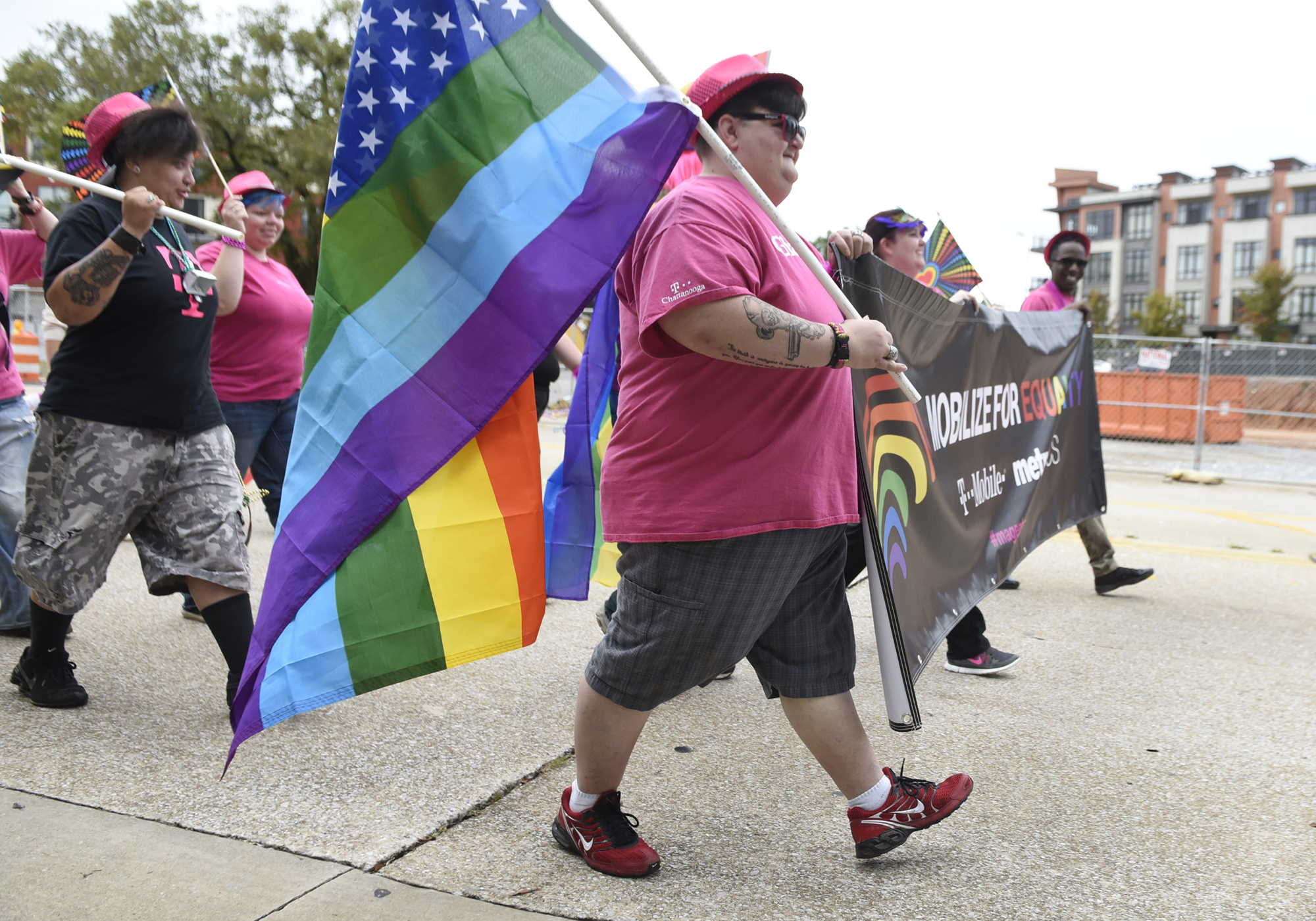 Makel Livingston, center, leads a group from T-Mobile during the Chattanooga Pride Festival parade on Riverfront Parkway on Sunday, Oct. 4, 2015., in Chattanooga, Tenn.