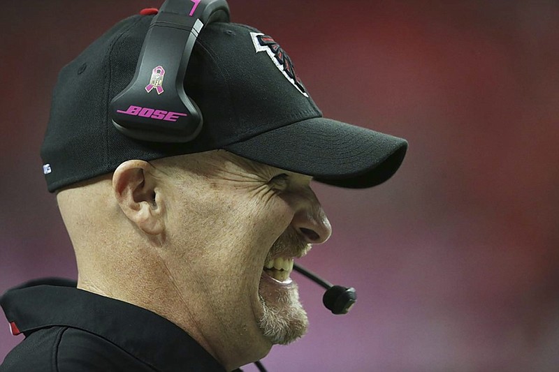 Atlanta Falcons head coach Dan Quinn grins while watching the second half of Sunday's blowout win over the Houston Texans at the Georgia Dome. Quinn, formerly the defensive coordinator for the Seattle Seahawks, is 4-0 in his first season leading the Falcons.