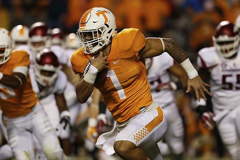 Tennessee running back Jalen Hurd picks up first-down yardage during Saturday night's game against Arkansas at Neyland Stadium. Hurd and fellow Volunteers running back Alvin Kamara were factors early but faded in the second half of the Vols' second straight SEC loss.