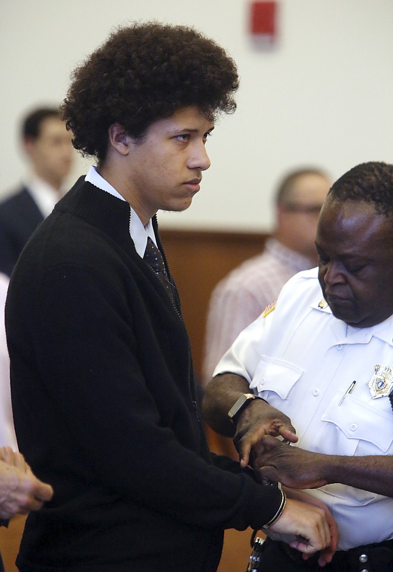 
              FILE - In this Tuesday, June 30, 2015 file photo, Philip Chism is handcuffed before being led out of Salem Superior Court after a hearing in Salem, Mass. Chism is charged with killing his Danvers High School math teacher in October 2013. Jury selection for his trial begins Wednesday, Oct. 7, 2015. (Ken Yuszkus/The Eagle Tribune via AP,  Pool, File)
            