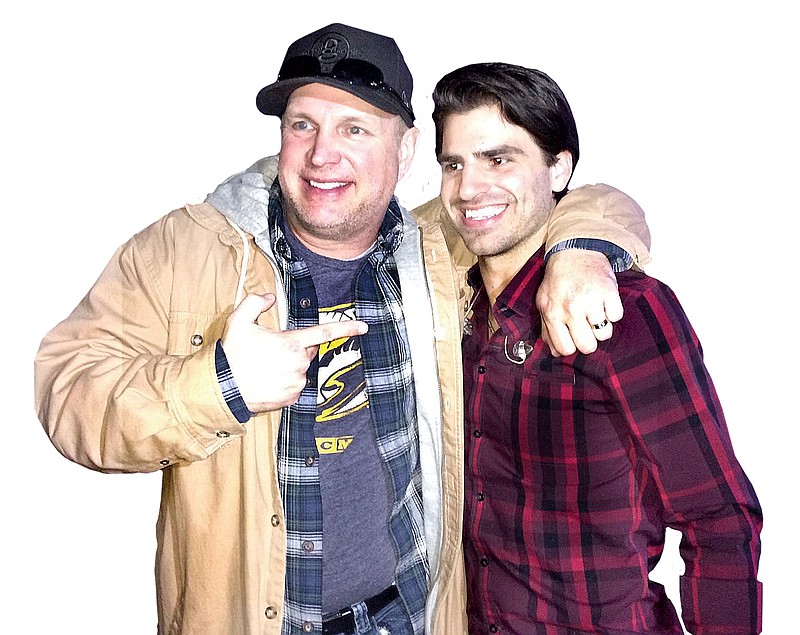 Mitch Rossell, right, recently had the surprise birthday of a lifetime when country superstar Garth Brooks, left, enlisted an entire audience to sing "Happy Birthday" to him.