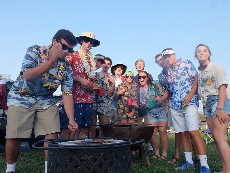 The Boyd-Buchanan Spirit Squad backs up grill master Colby Morgan during tailgating before Friday's game with Brainerd at home.