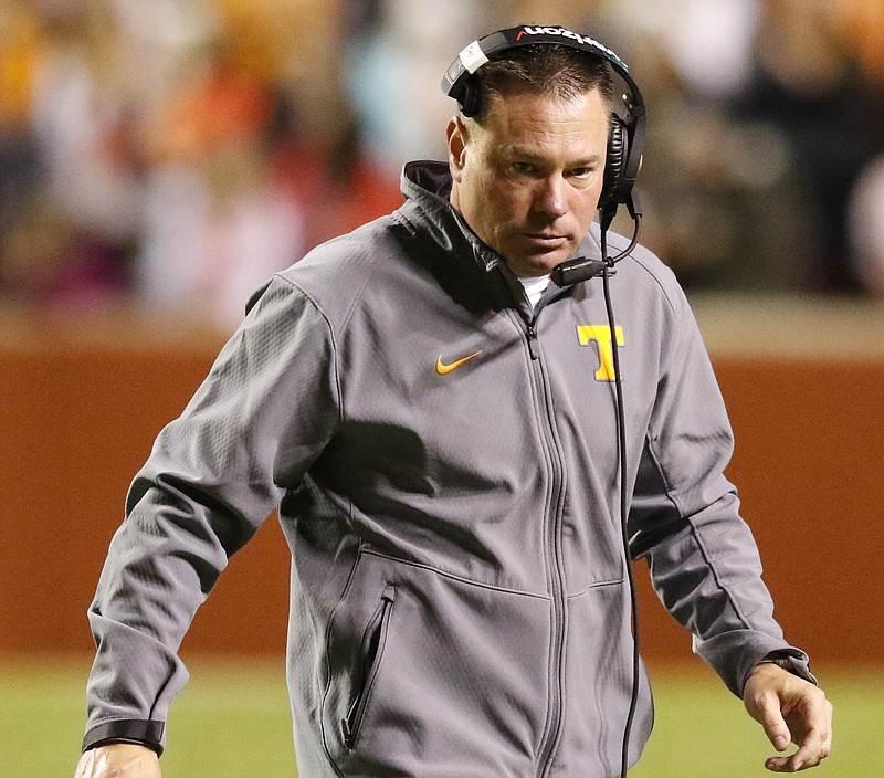 UT's head coach Butch Jones exits the field after a timeout while playing Arkansas during the second quarter of play on Oct. 3, 2015.