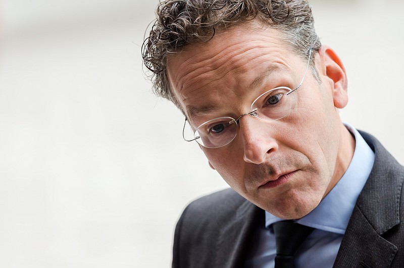 
              Dutch Finance Minister and chair of the eurogroup finance ministers Jeroen Dijsselbloem talks with journalists as he arrives for a meeting of eurogroup finance ministers at the EU Council building in Luxembourg, Monday, Oct. 5, 2015. (AP Photo/Geert Vanden Wijngaert)
            