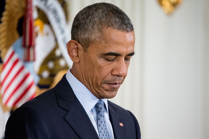 
              FILE- In this Oct. 2, 2015, file photo, President Barack Obama takes questions from members of the media in the State Dining Room of the White House in Washington. Buried in the 1,915-page defense policy bill are major changes that could affect more than 1 million members of the military and their families. Obama has threatened to veto the legislation as part of a larger budget debate on Capitol Hill. (AP Photo/Andrew Harnik, File)
            