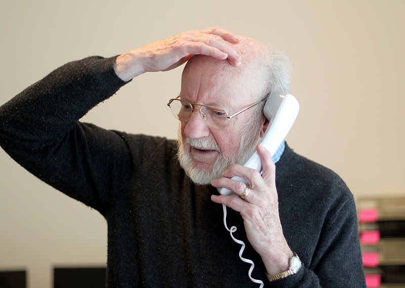 Scientist William C. Campbell talks on the phone at his home in North Andover, Mass., Monday, Oct. 5, 2015. Campbell is one of three scientists from the U.S., Japan and China who won the Nobel Prize in medicine on Monday for discovering drugs to fight malaria and other tropical diseases that affect hundreds of millions of people every year. 