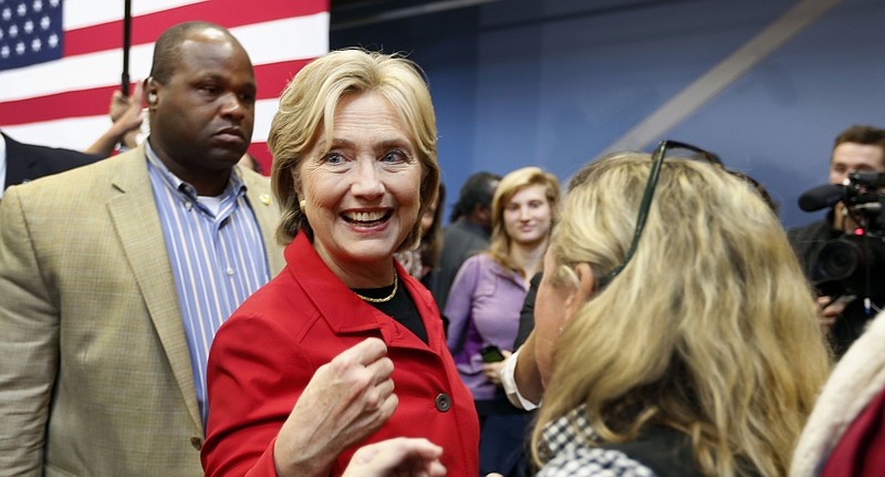 
              Democratic presidential candidate Hillary Rodham Clinton greets voters during a campaign stop at the Manchester Community College, Monday, Oct. 5, 2015, in Manchester, N.H. (AP Photo/Jim Cole)
            