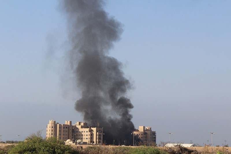 
              Smoke rises following an explosion that hit Hotel al-Qasr where Cabinet members and other government officials are staying, in the southern port city of Aden, Yemen, Tuesday, Oct. 6, 2015. Security officials, who work for Yemen's internationally recognized government said three explosions have hit Aden and there are casualties in Tuesday's explosions but they had no specifics or details. (AP Photo/Wael Qubady)
            