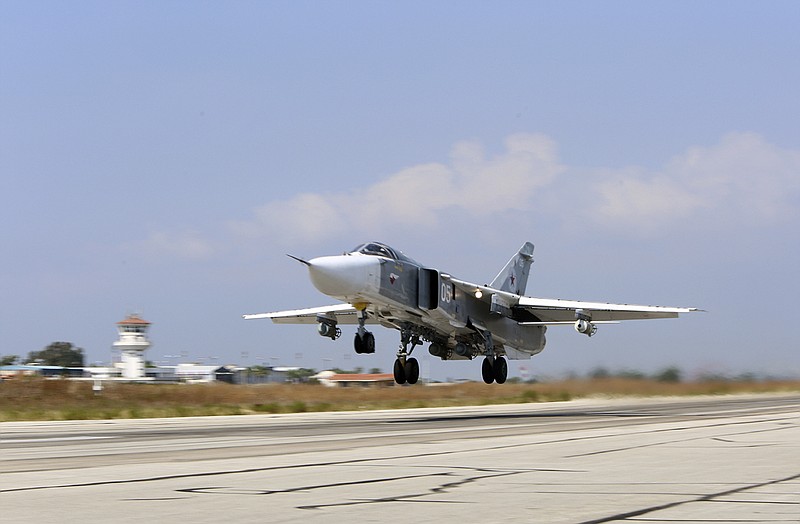 
              In this photo taken on Saturday, Oct.  3, 2015, Russian  SU-24M jet fighter armed with laser guided bombs takes off from a runaway at Hmeimim airbase in Syria.  The skies over Syria are increasingly crowded, and increasingly dangerous. The air forces of multiple countries are on the attack, often at cross purposes in Syria’s civil war, sometimes without coordination and now, it seems, at risk of unintended conflict. The latest entry in the air war is Russia. It says it is bombing the Islamic State in line with U.S. priorities, but the U.S. says Russia is mainly striking anti-government rebels in support of its ally, President Bashar Assad. The Russians, who are not coordinating with the Americans, reportedly also have hit U.S.-supported rebel groups.  (AP Photo/Alexander Kots, Komsomolskaya Pravda, Photo via AP)
            