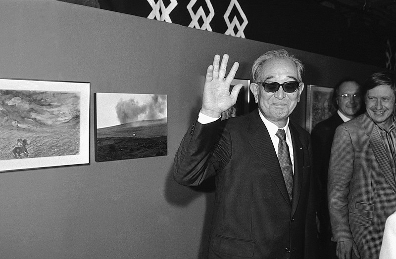 
              FILE - In this Sept. 19, 1985 photo, Japanese movie director Akira Kurosawa salutes the photographers when visiting the exhibition "About Ran" held at Paris Georges Pompidou National Center for Art and Culture. To mark the Busan festival’s 20th anniversary, the 100 greatest Asian films of all time were selected. Yasujiro Ozu’s 1953 drama “Tokyo Story” was their top selection, followed by Akira Kurosawa’s 1950 work “Rashomon” and Wong Kar Wai’s “In the Mood for Love.” (AP Photo/Olivier Boitet, File)
            