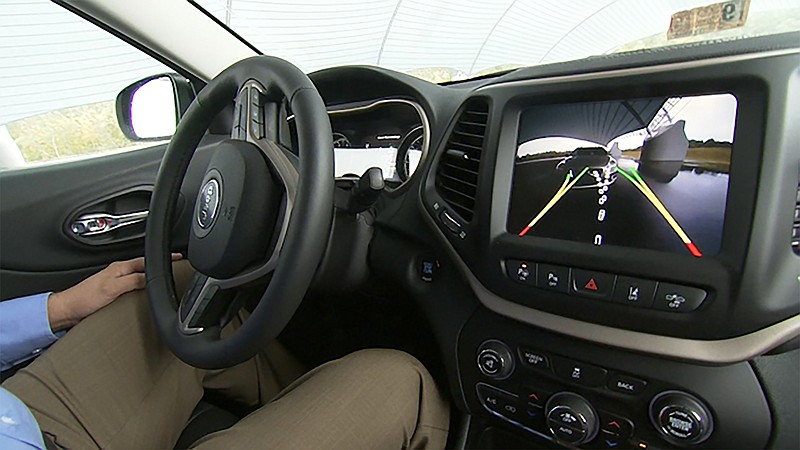 
              This image from video, taken Oct. 1, 2015, shows  Insurance Institute for Highway Safety (IIHS) Senior Research Engineer David Aylor in the drivers seat with an electronic display on the dashboard for parallel parking assistance at the IIHS Vehicle Research Center in Ruckersville, Va. American car buyers are baffled by a blizzard of new safety technologies in vehicles that vary from manufacturer to manufacturer, from model to model, and from one options package to another. (AP Photo/Dan Huff)
            