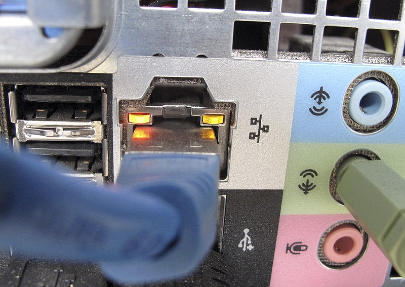 
              This Oct. 8, 2009 file photo shows a network cable plugged into the back of a computer in Duesseldorf, Germany. Cybercrime costs are climbing for companies both in the U.S. and overseas amid a slew of high-profile breaches, according to research released Tuesday, Oct. 6, 2015. (AP Photo/Frank Augstein, File)
            