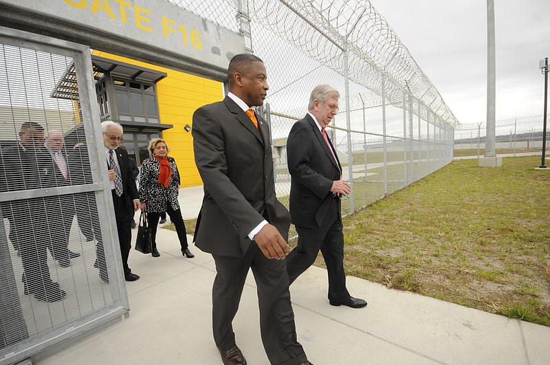 Department of Corrections Commissioner Derrick Schofield, left, takes a tour of the Bledsoe County Correctional Complex in 2012.