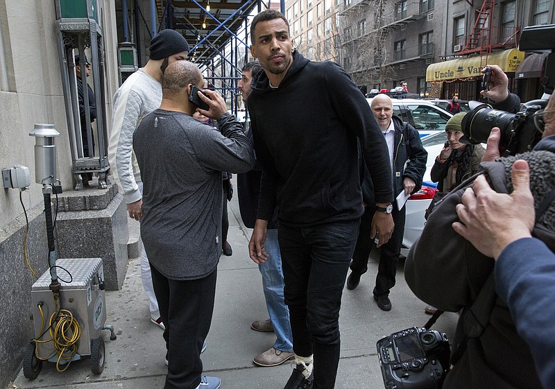 
              FILE - In this photo from Wednesday, April 8, 2015, Atlanta Hawks forward Thabo Sefolosha, center, leaves a courthouse in New York.  Sefolosha plans to fight charges he blocked officers from setting up a crime scene following the stabbing of Indiana Pacers' Chris Copeland  outside a trendy Manhattan nightclub in April. (AP Photo/Craig Ruttle, File)
            