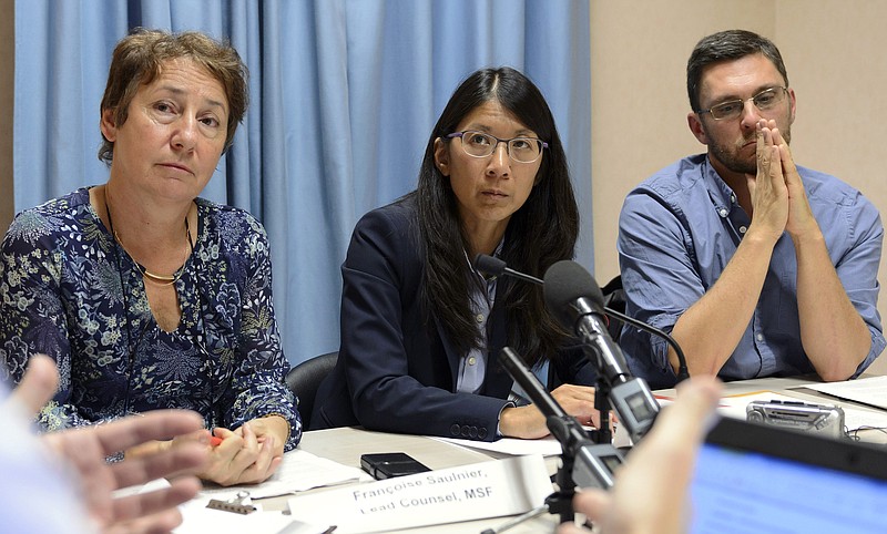 
              Francoise Saulnier, Medecins Sans Frontieres, MSF, lead counsel, Joanne Liu, President of MSF International, and Bruno Jochum, Director General of MSF Switzerland, from left to right, attend a news conference on the US air strike on a hospital in Kunduz, Afghanistan, in Geneva, Switzerland, Wednesday, Oct. 07, 2015. Liu, told reporters that the weekend strike “was not just an attack on our hospital, it was an attack on the Geneva Conventions. This cannot be tolerated.” (Martial Trezzini/Keystone via AP)
            