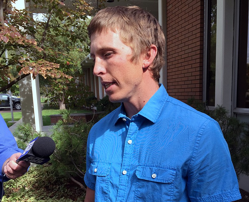 Stephen Vouch of Boise, talks to a reporter on Wednesday, Oct. 7, 2015 at the Idaho Department of Fish and Game in Boise, Idaho and describes being bitten in the back of the head by a black bear while he slept at a hunting camp in central Idaho on Oct. 2. The attack left Vouch, 29, with cuts to the back of his head but he didn't need stitches. A hunting companion shot and wounded the bear that Vouch then shot and killed. State officials estimated the black bear was 3 to 7 years old and weighed from 200 to 275 pounds.