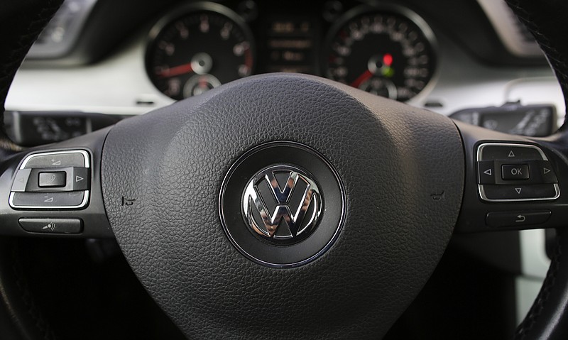 The VW logo is seen on a steering wheel of a VW car in Berlin, Germany.