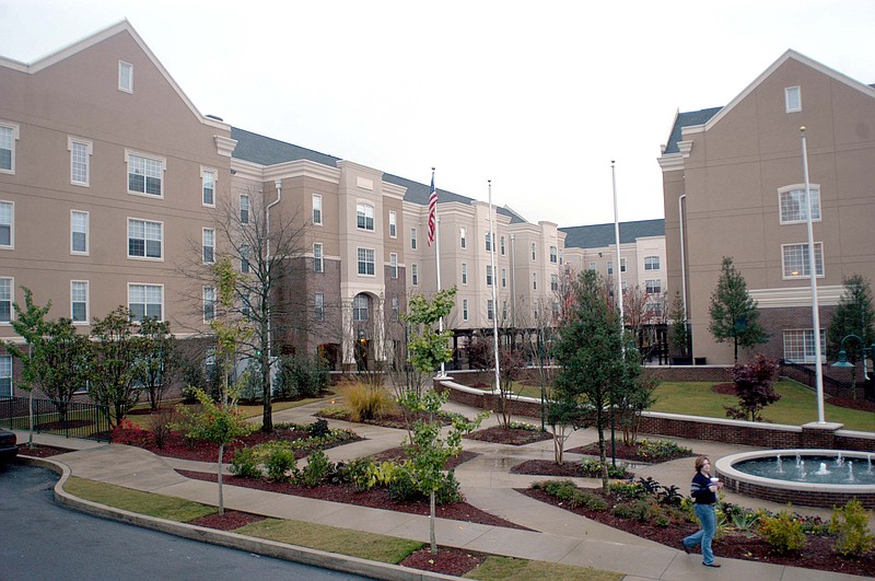 University of Tennessee at Chattanooga senior Katie Welch walks out of the UTC Place 3000 building Tuesday afternoon.  Ms. Welch has lived in the new dorms for two years.