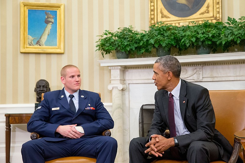 
              FILE - In this Sept. 17, 2015 file photo, President Barack Obama speaks to Air Force Airman 1st Class Spencer Stone in the Oval Office of the White House in Washington. An Air Force spokesman says Stone, who helped subdue an attacker on a French train in August, is in stable condition after being stabbed in California. (AP Photo/Andrew Harnik, File)
            