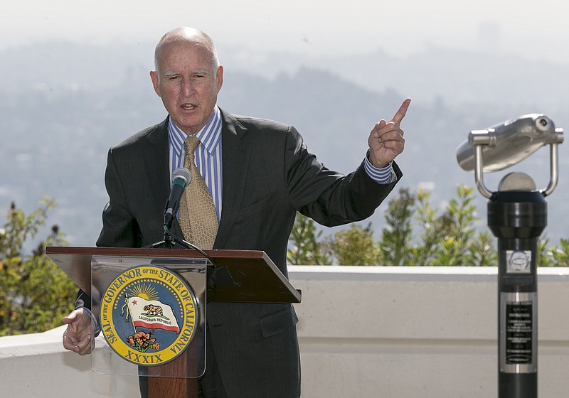 
              California Gov. Jerry Brown speaks before signing a bill to combat climate change by increasing the state's renewable electricity use to 50 percent and doubling energy efficiency in existing buildings by 2030 at a ceremony at the Griffith Observatory in Los Angeles on Wednesday, Oct. 7, 2015. (AP Photo/Damian Dovarganes)
            