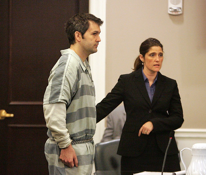 
              FILE - In this Sept. 11, 2015, file photo, Michael Slager, left, stands as one of his attorneys, Cameron Blazer, guides him toward the podium in Charleston, S.C. Slager is charged in the April 4 death of Walter Scott after a traffic stop. City officials in South Carolina approved a $6.5 million settlement Thursday, Oct. 8, 2015, with the family of Scott. (Leroy Burnell/The Post And Courier via AP, File) MANDATORY CREDIT
            