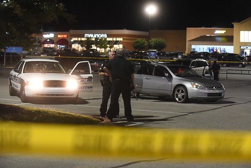 Chattanooga police officers work the scene of a shooting Monday, Sept. 28, 2015 at the Wal-Mart on Highway 153.