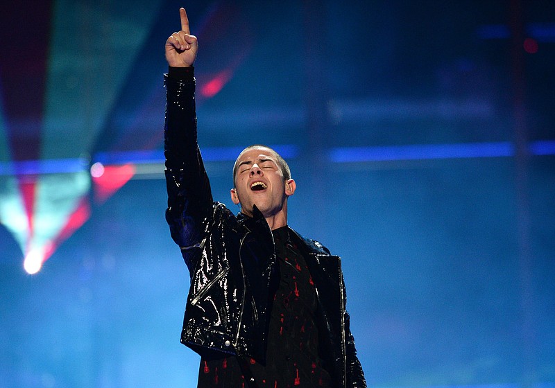 
              FILE - In this Sept. 19, 2015 file photo, Nick Jonas performs at Day 2 of the 2015 iHeartRadio Music Festival in Las Vegas, Nev. Jonas, along with rappers Rick Ross, Meek Mill and French Montana will be performing at a star-studded concert held by the streaming service Tidal. The concert, “TIDAL X: 1020 Amplified by HTC,” will be held at the Barclays Center in Brooklyn, New York, on Oct. 20. (Photo by Al Powers/Powers Imagery/Invision/AP, File)
            