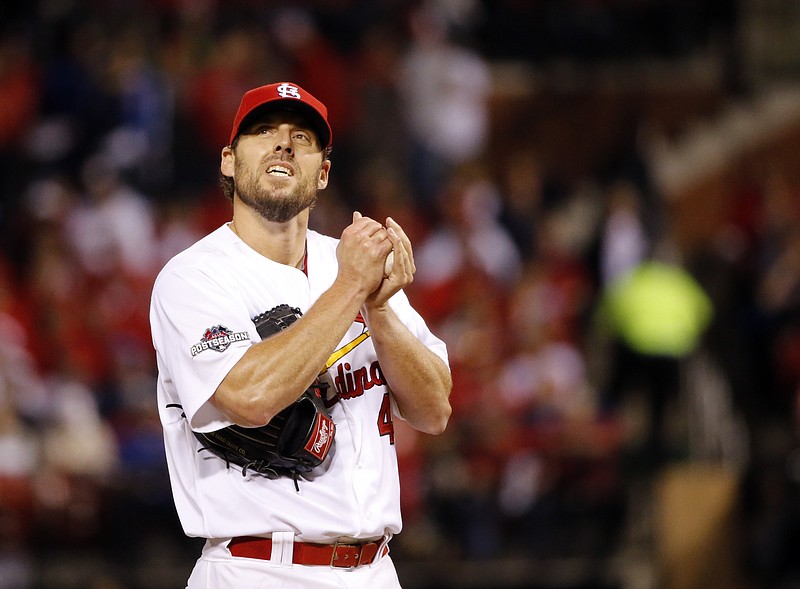 St. Louis Cardinals starting pitcher John Lackey waits to throw during the fourth inning of Game 1 in baseball's National League Division Series against the Chicago Cubs, Friday, Oct. 9, 2015, in St. Louis. 