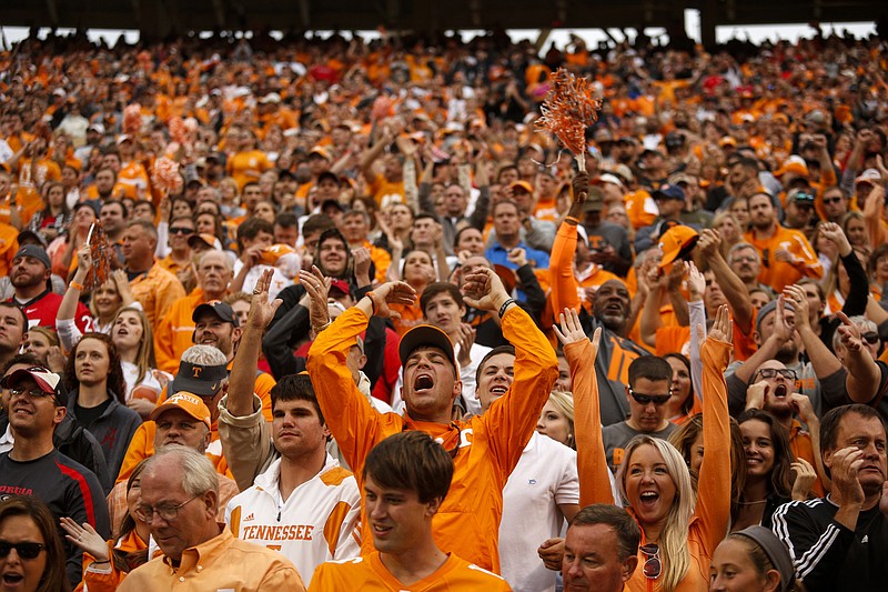 Tennessee fans cheer as the Vols score during their SEC football game against Georgia at Neyland Stadium on Saturday, Oct. 10, 2015, in Knoxville, Tenn. Tennessee won 38-31.