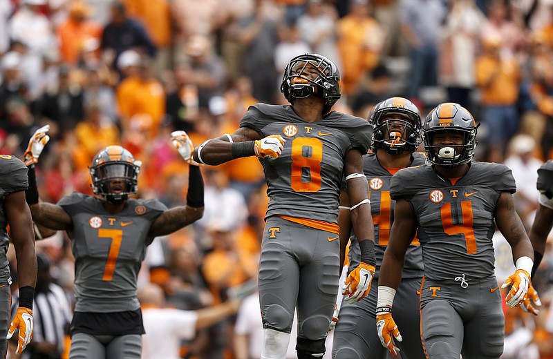 Tennessee cornerback Justin Martin (8) tries to pump up the crowd before the kickoff of the Vols' SEC football game against Georgia at Neyland Stadium on Saturday, Oct. 10, 2015, in Knoxville, Tenn. Tennessee won 38-31.