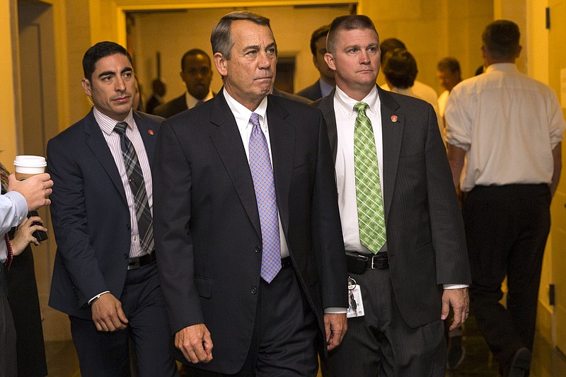 
              Outgoing House Speaker John Boehner of Ohio arrives for a meeting where Republicans will nominate candidates to replace him, Thursday, Oct. 8, 2015, on Capitol Hill in Washington.  After two tumultuous weeks that saw the current speaker announce his resignation and his heir apparent abruptly pull out of the running, House Republicans are in disarray as they confront a leadership vacuum. (AP Photo/Evan Vucci)
            