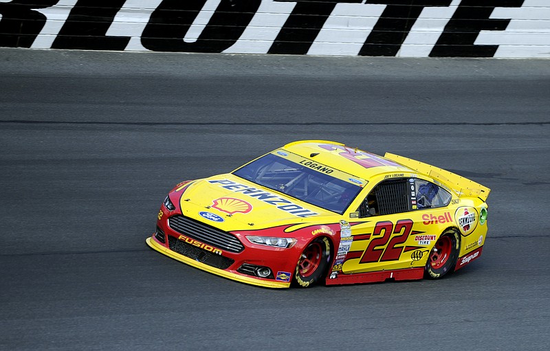 
              Joey Logano drives his car out of Turn 4 during the NASCAR Sprint Cup series auto race at Charlotte Motor Speedway in Concord, N.C., Sunday, Oct. 11, 2015. (AP Photo/Mike McCarn)
            