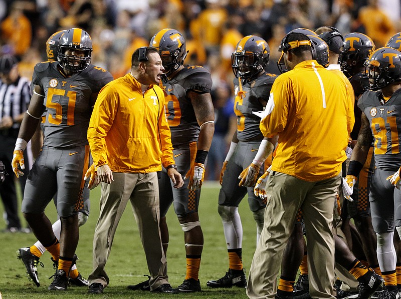 Tennessee head coach Butch Jones shouts to players during a timeout in their SEC football game against Georgia at Neyland Stadium on Saturday, Oct. 10, 2015, in Knoxville, Tenn. Tennessee won 38-31.