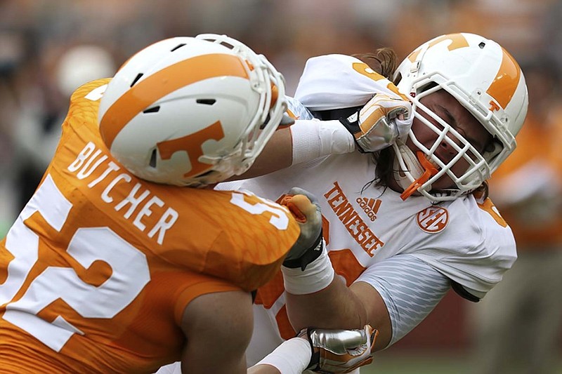Tennessee freshman offensive lineman Jack Jones, right, shown battling with teammate Andrew Butcher during the spring game, made an impact for the Volunteers in Saturday's win over Southeastern Conference rival Georgia.