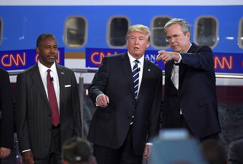 In the GOP presidential primary race so far, candidates Dr. Ben Carson, left, and Donald Trump, center, are outpolling establishment candidates such as former Florida Gov. Jeb Bush, at right. The other "outsider" candidate, Carly Fiorina, also is polling ahead of establishment candidates.