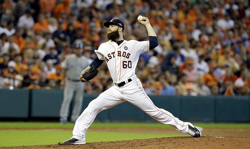 Houston Astros starting pitcher Dallas Keuchel throws against the Kansas City Royals during the seventh inning in Game 3 of baseball's American League Division Series Sunday, Oct. 11, 2015, in Houston.