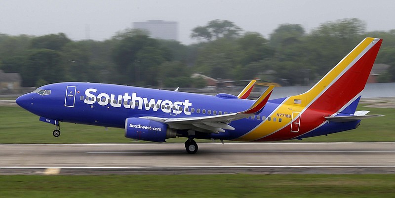 A Southwest airlines jet takes off from a runway at Love Field in Dallas in this April 23, 2015, file photo. Southwest Airlines is asking travelers on Sunday, Oct. 11, to arrive at least two hours before their scheduled departures as technical issues are forcing it to check-in some customers manually.