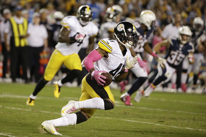 
              Pittsburgh Steelers cornerback Antwon Blake runs on his way to a touchdown off an interception while playing the San Diego Chargers during the second half of an NFL football game Monday, Oct. 12, 2015, in San Diego. (AP Photo/Lenny Ignelzi)
            