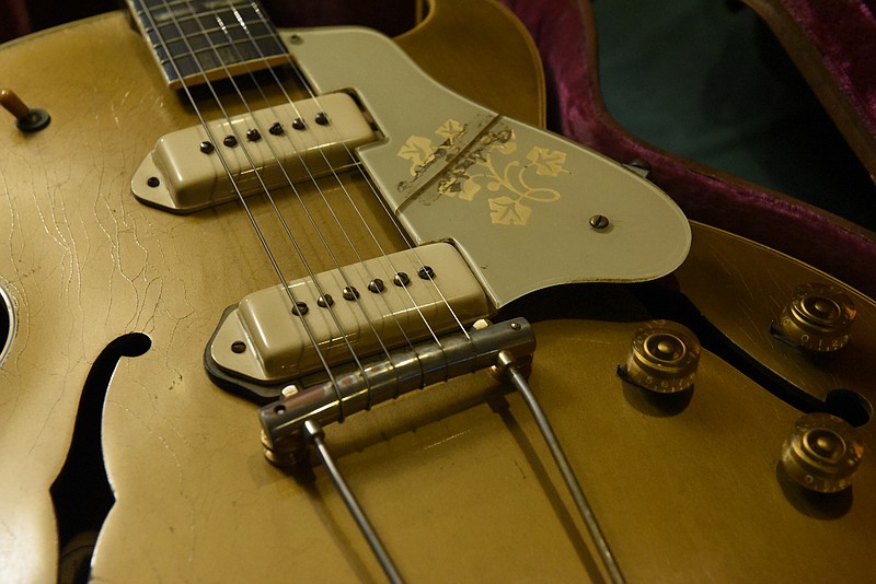 This 1954 Gibson ES 295 is one of the most prized possessions in the guitar collection of Brad Putt, seen at his store, Main Stage Music, on Wednesday, Oct. 7, 2015, in Dayton, Tenn. This style of gold-colored guitar was popularized by Scotty Moore, Elvis Presley's guitar player. 