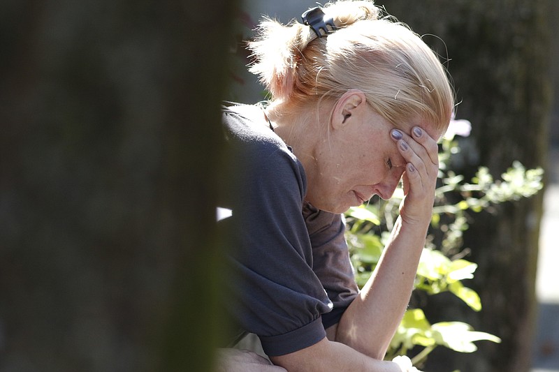 Staff Photo by Dan Henry / The Chattanooga Times Free Press- 10/12/15. Stacey Cordell reacts emotionally on Monday, October 12, 2015 moments after finding out that the Cleveland, Tennessee, District Attorney's office will not investigate her case further after receiving her rape kit results.